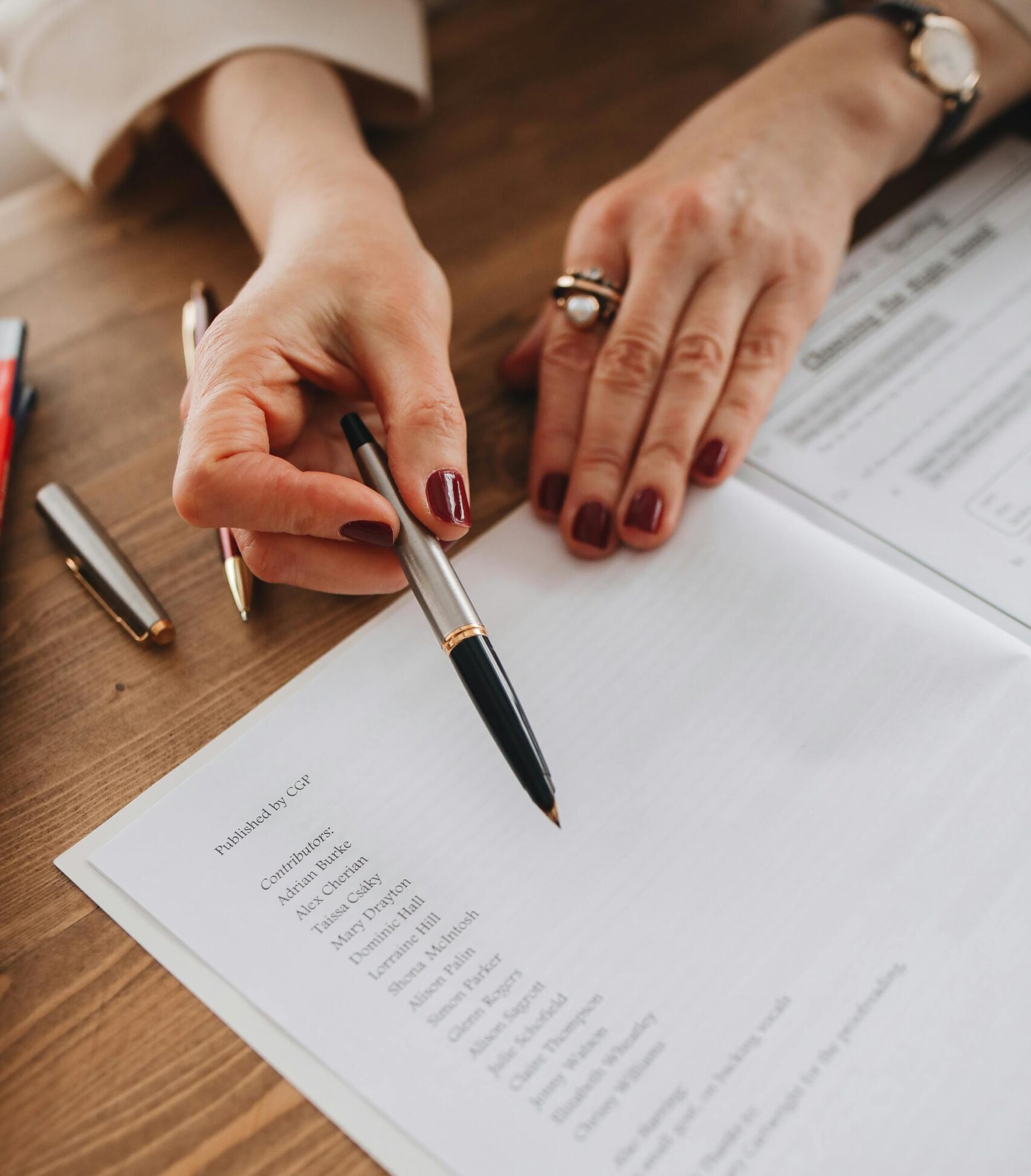 Close-Up View of a Person Holding a Pen